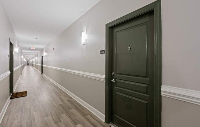 Flatiron West Trade Apartments black door in hallway
