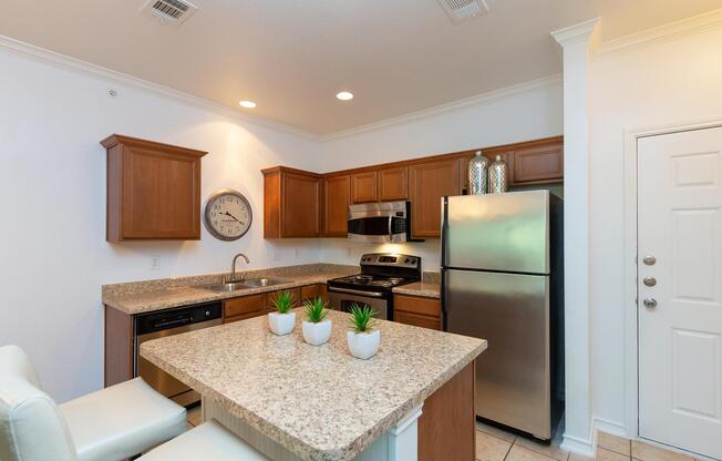 a kitchen with a sink and a mirror