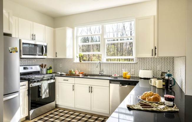 a kitchen with a stove and a sink