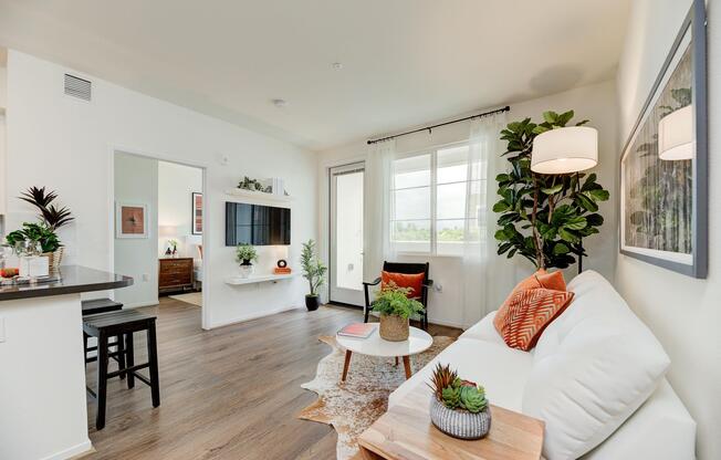 a living room filled with furniture and a flat screen tv