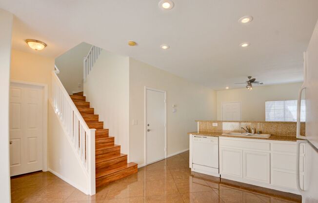 Beautiful two bedroom in great location. Step through the front door into a sun-filled great room featuring oversized tile flooring, recessed lighting, and a modern ceiling fan. Large windows and a glass slider invite natural light and frame the connectio