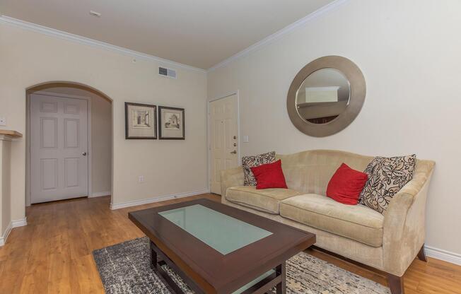 a living room filled with furniture and a table