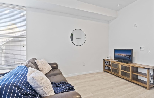 a living room with a couch and a television