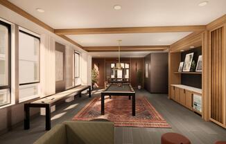 The game room at Modera Bridle Trails pairs a cozy fireplace with warm wood paneling for relaxed evenings and friendly competition.