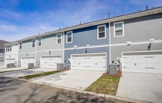 a blue house with a white garage door