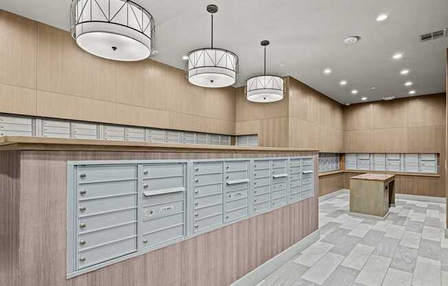 A row of mailboxes on a wall in a room.