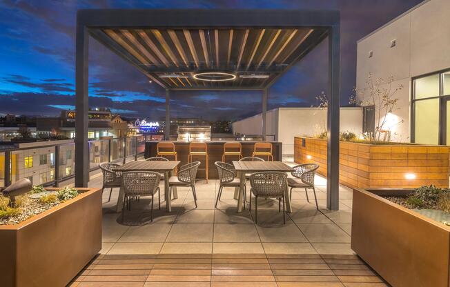Outdoor dining area and BBQ grilling stations.