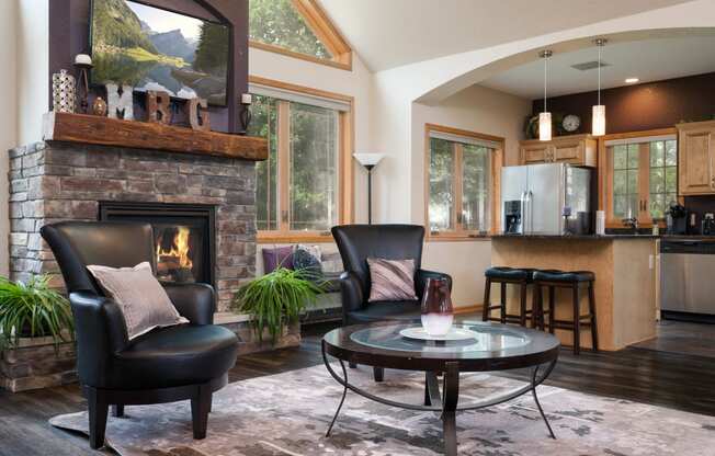 a living room with a fireplace and a table