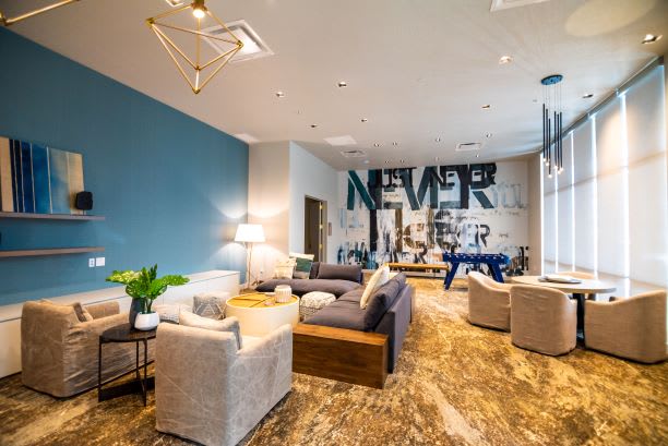 Clubroom With Smart Tv And Ample Sitting Area at Soleil Lofts Apartments, Herriman, UT, 84096