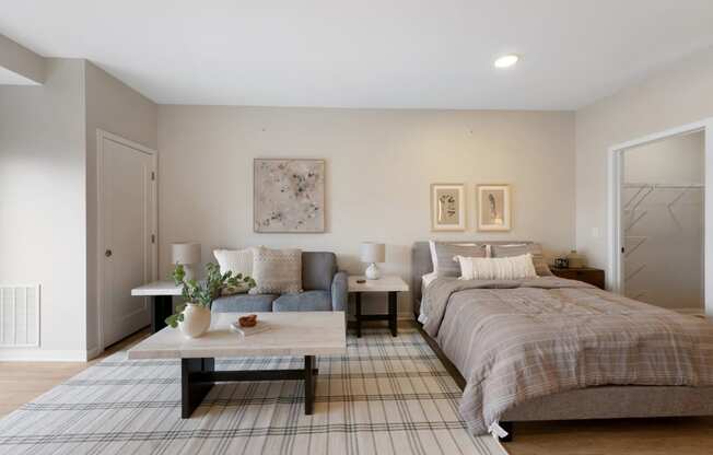 a bedroom with a bed and a couch