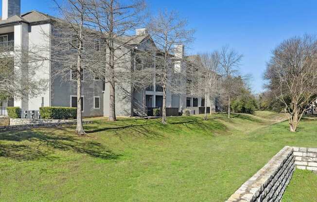 A large building with a grassy area in front of it.