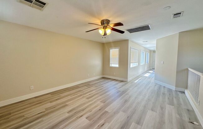 Newly renovated beautiful two story house with brand new vinyl plank flooring, an extra long driveway, and a covered front patio!
