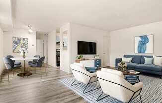 A living room with a white table and blue couch.