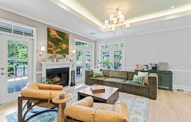 A living room with a fireplace and a painting on the wall.