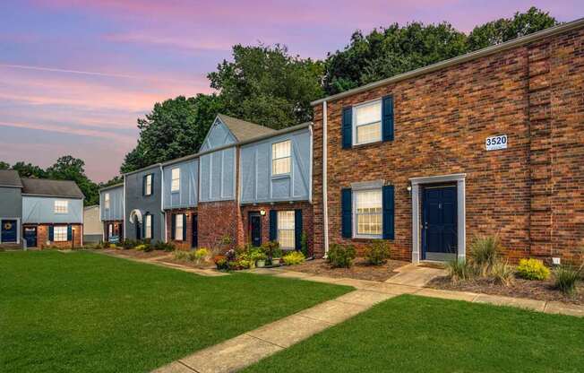 A row of houses with the number 3520 on the brick house.