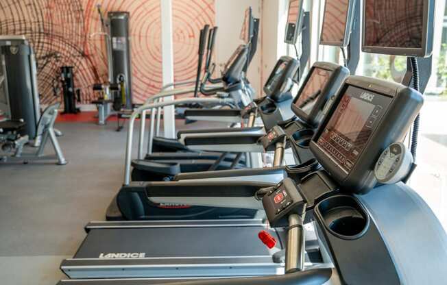 a row of cardio machines in a fitness gym at 20 Midtown, Birmingham, Alabama