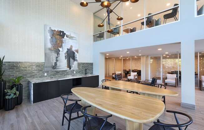 a conference room with a large wooden table and chairs