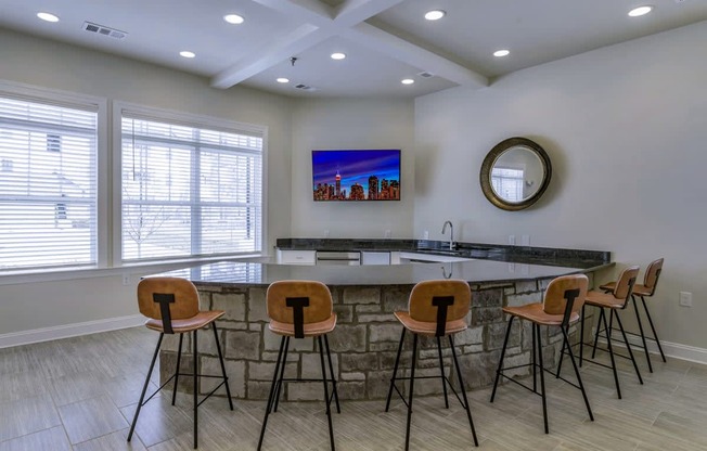 Ashland Farms Resident Clubhouse with Bar Seating, Flat Screen TV, and Large Windows