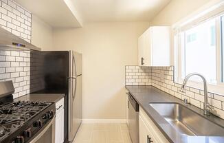 a modern kitchen with stainless steel appliances