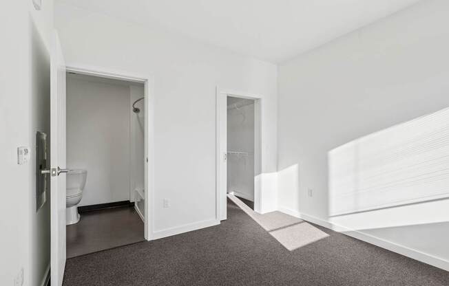 A white bathroom with a toilet and sink.