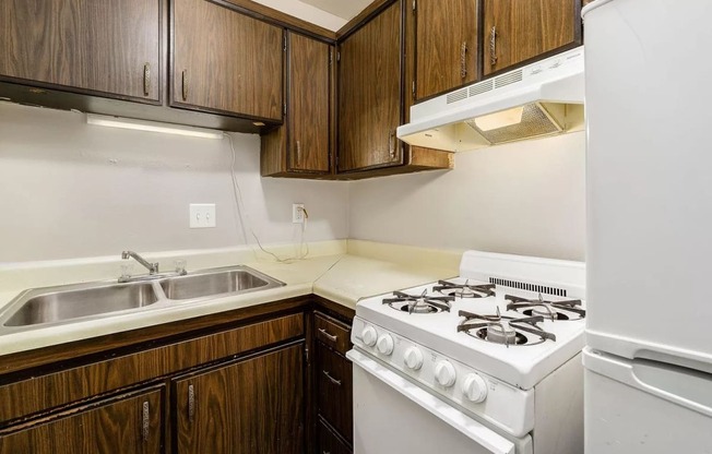a kitchen with a stove and a sink