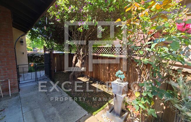 2/1 Single Story Condo With 2 Car Garage, Private Front & Back Patio & Updates Throughout!