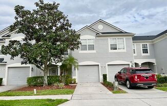 MOVE IN NOW! Beautiful 3 bed 2.5 bath townhome with large screened in back porch & 1 car attached garage!! In man gated Spring Isle/Avalon Park!!