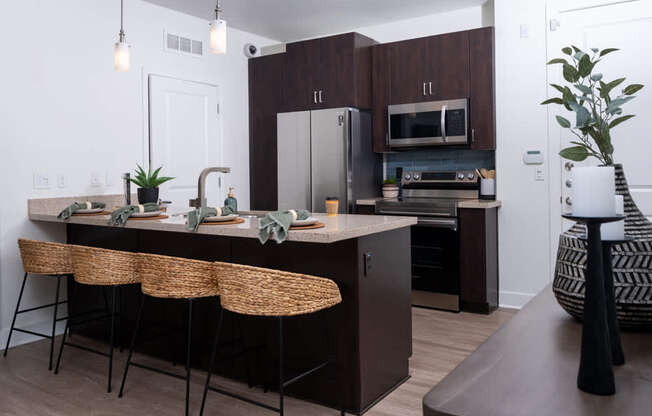 A kitchen with brown cabinets and a white countertop.