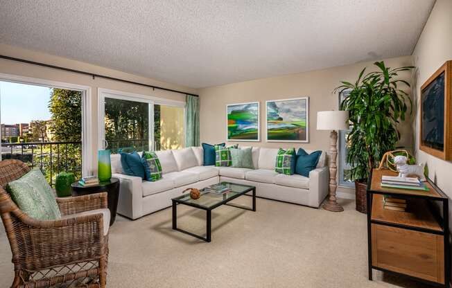 a living room with a white couch and a table