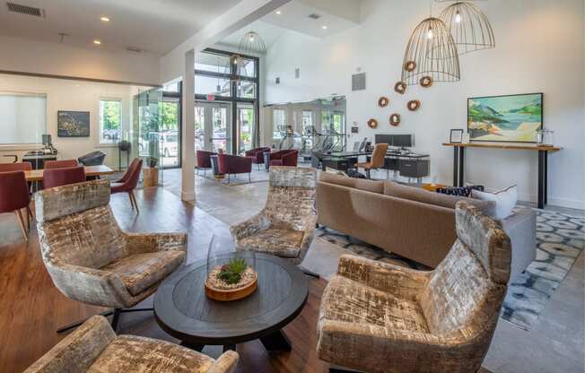 a living room with couches and chairs and a table