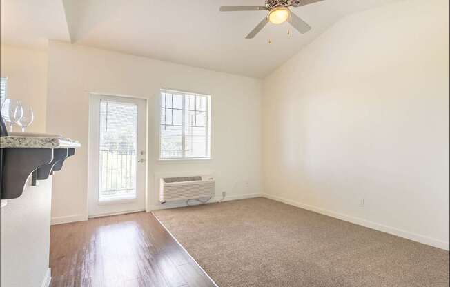 A room with a ceiling fan and a window at Riverplace Apartment Homes, Oregon