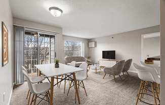 A modern dining room with a large table and chairs.