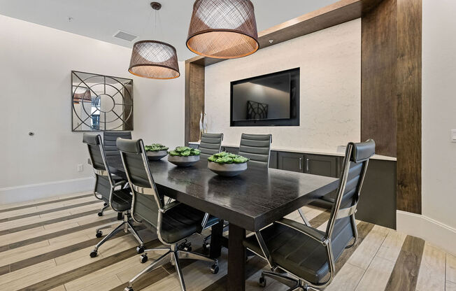 Conference table with TV for presentations available for use by residents