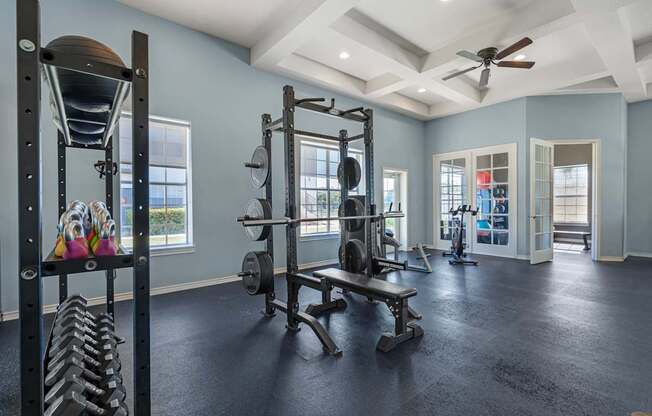 A spacious home gym with a variety of exercise equipment.
