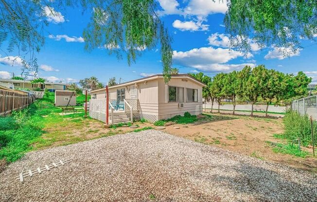 Charming 3-Bed/2-Bath Mobile Home with Fenced Yard In Homeland!