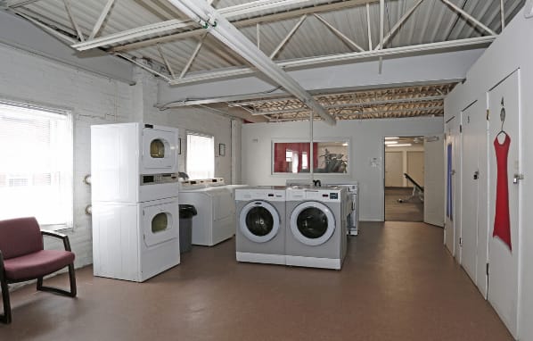 Lewis Manor community laundry room with washers and dryers.