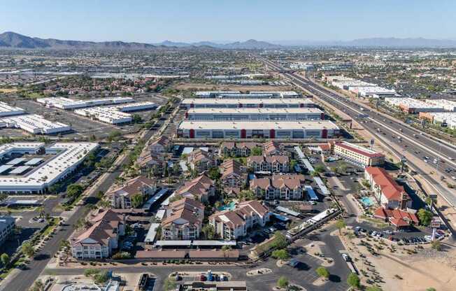 A large aerial view of a commercial area with buildings and roads.