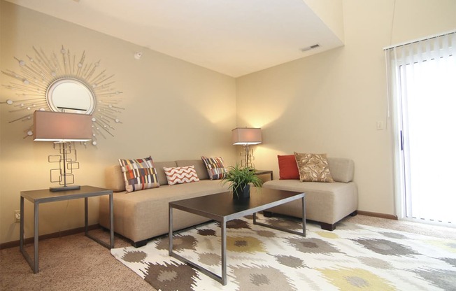 Bright natural lighting in living space at Pine Lake Apartments