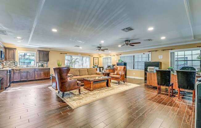 A spacious living room with wooden floors and furniture.