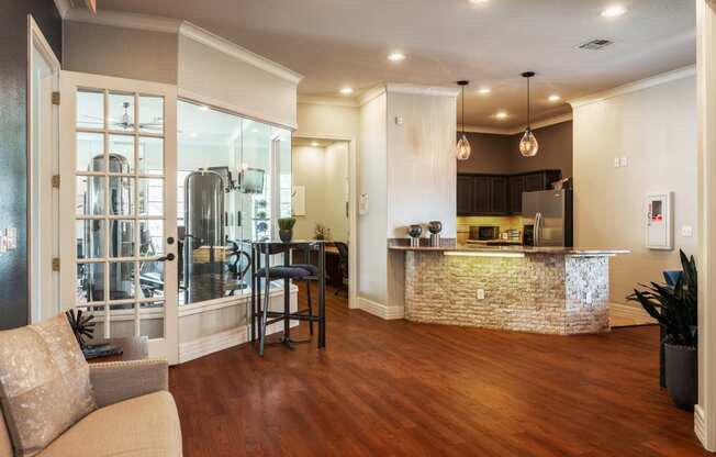 a kitchen and living room with hardwood floors