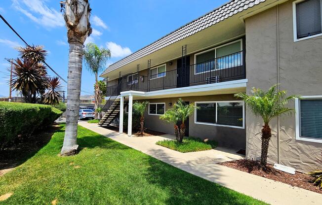 a house in front of a brick building