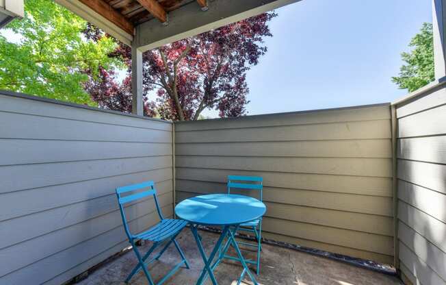  Private Patio Porch for Outdoor Space with Bliue Foldable Chairs, and Blue Table