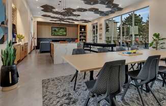 a dining room with a table and chairs