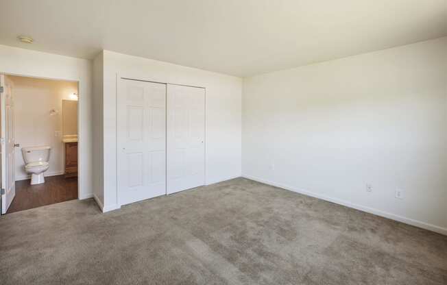 a room with carpet and a toilet in it