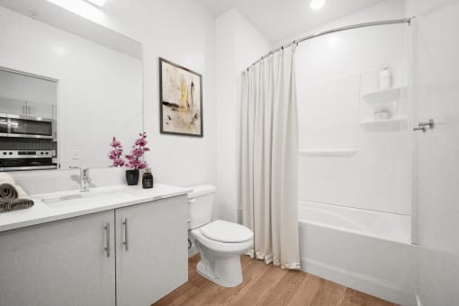 a bathroom with a shower and a sink and a toilet  at SevenO2 Main Apartments, Salt Lake City