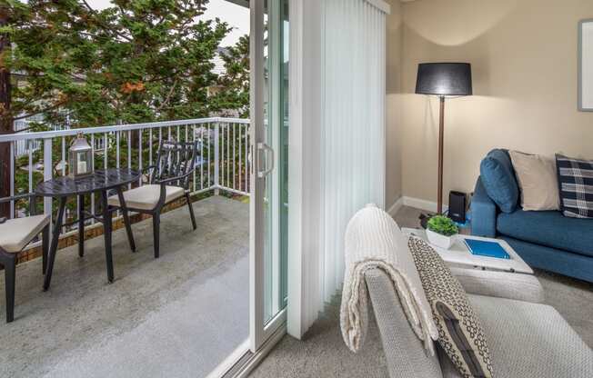 a living room with sliding glass doors to a balcony