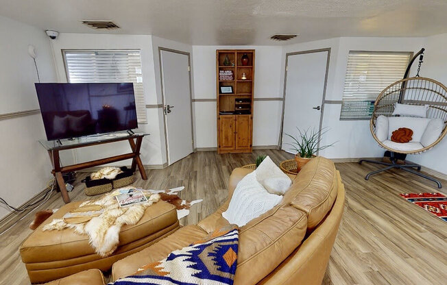 a clubhouse room with a couch and a television