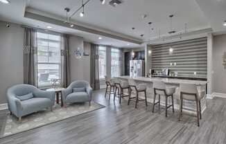 a clubhouse with a bar and chairs and a kitchen at Nexus at Sandhill, Columbia South Carolina