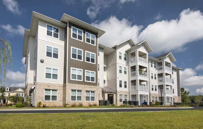 Residential building with 4 stories and private balconies at at the Station at Savannah Quarters in Pooler, GA