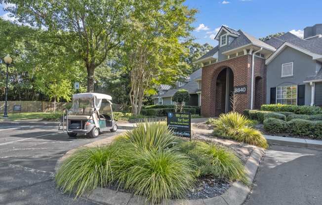 a golf cart parked in front of a house